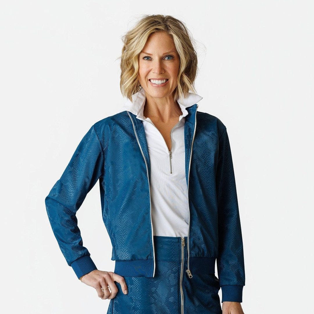 Woman wearing a blue jacket and skirt with a white shirt on a white background