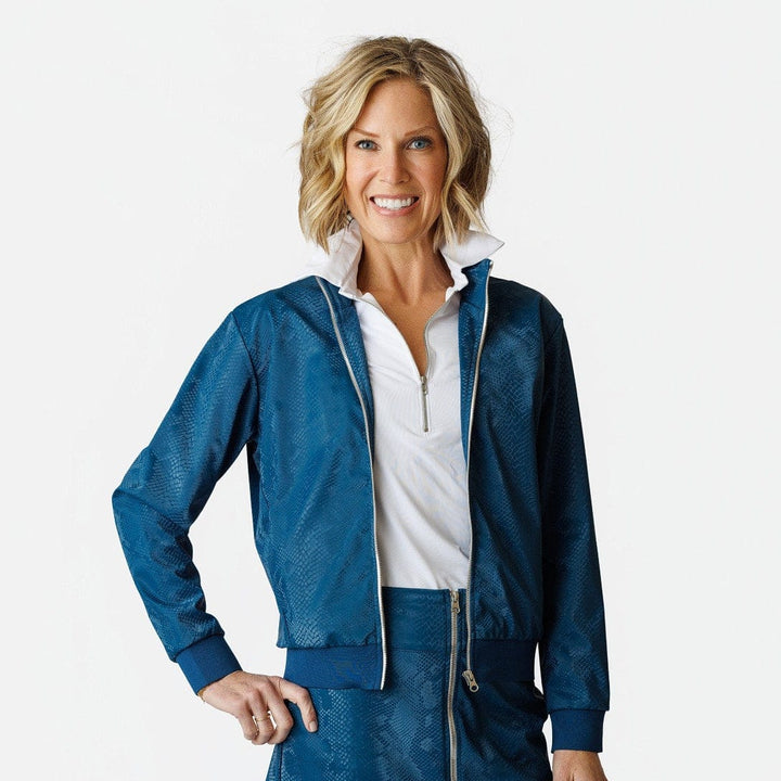 Woman wearing a blue jacket and skirt with a white shirt on a white background